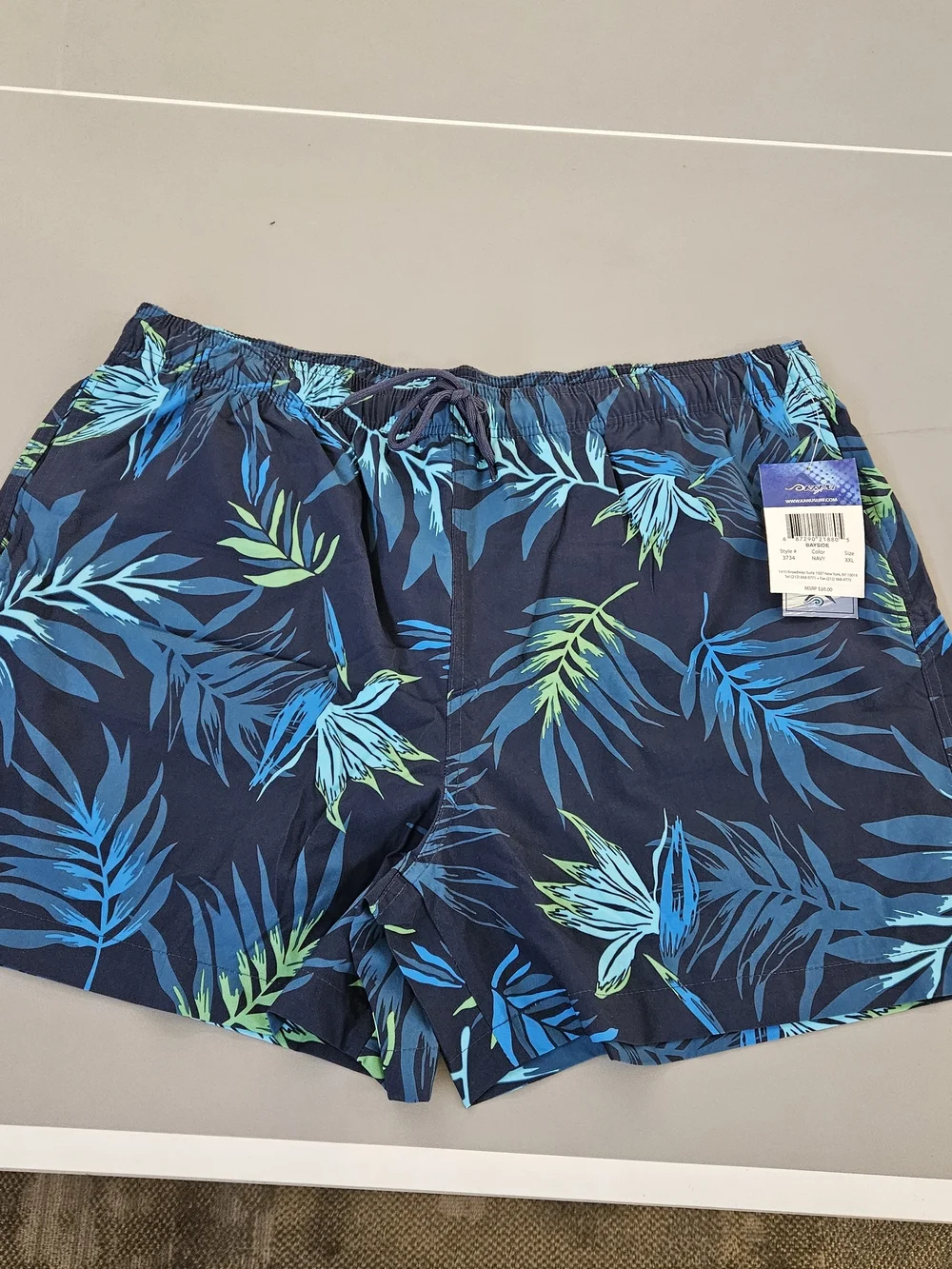 Kanu Surf Navy Swim Trunks with Blue & Green Tropical Leaves